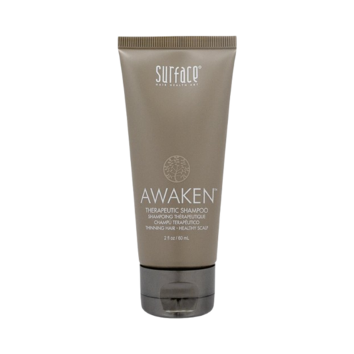 Surface Awaken Therapeutic Shampoo on white background