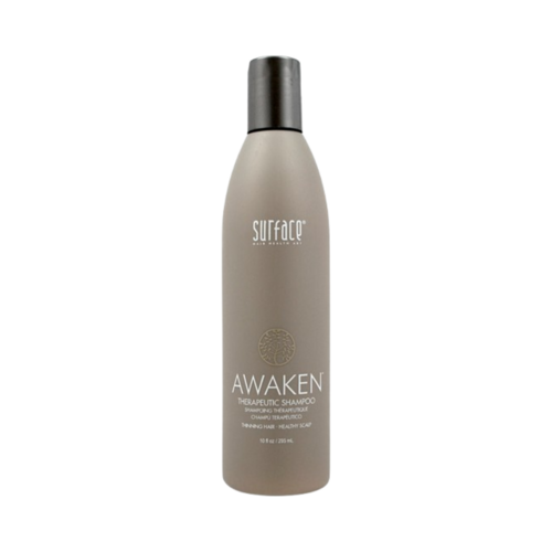 Surface Awaken Therapeutic Shampoo on white background